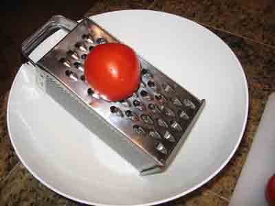 Beginning to grate tomato