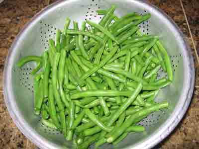 Green beans draining in colander.