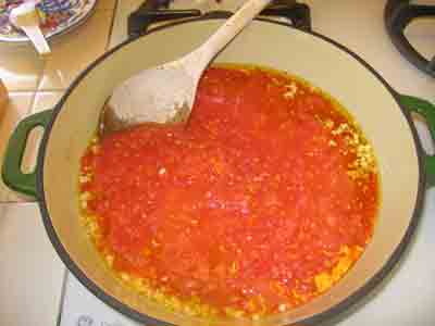 Simmering the tomato sauce.