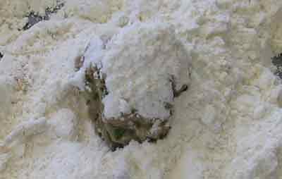 Cover blob of meat with flour for greek recipe keftedes kalokairinoi summer meatballs.