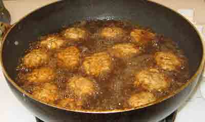 Frying the summer meatballs for greek recipe keftedes kalokairinoi