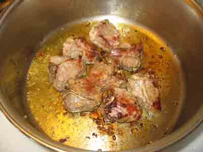 Browning the lamb chops for fricassee.
