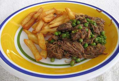 Leftover meat with fries.