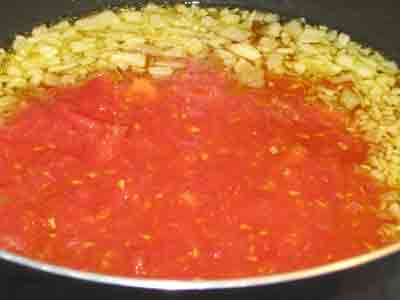 Add tomatoes and simmer.