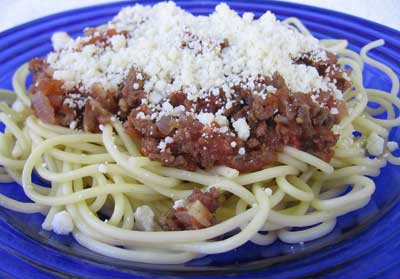 A serving of makaronia me kima, the greek recipe for spaghetti with meat sauce.