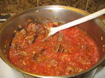 Stir and add liquid if necessary for greek food recipe moschari me fasolakia.