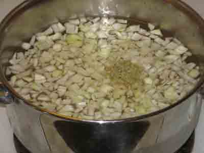Garbanzo soup ingredients in pot.