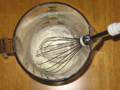 Whisk a little water into 1 TB flour.